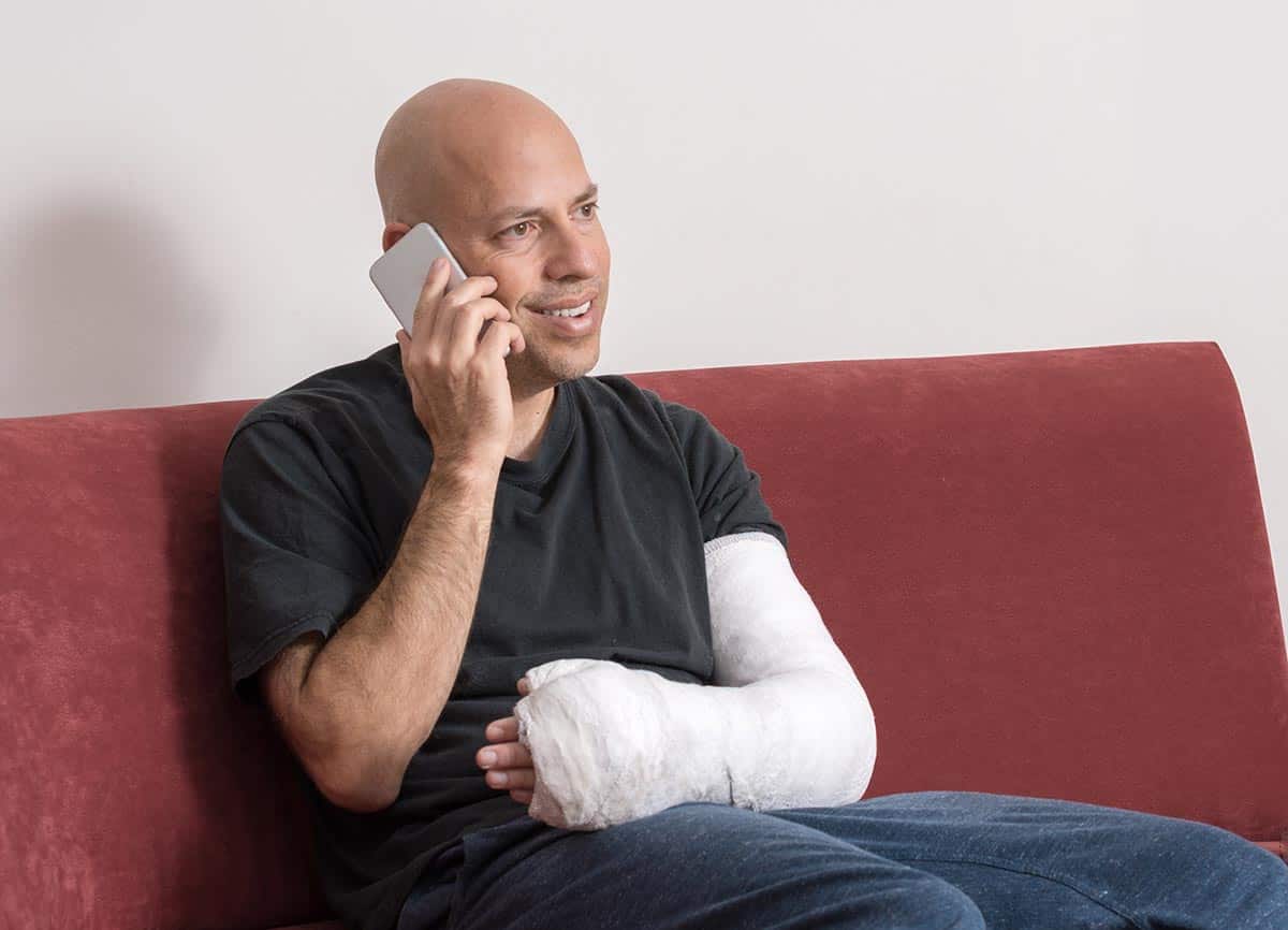 Injured man speaking with his Personal Injury Lawyer in Pennsylvania over the phone