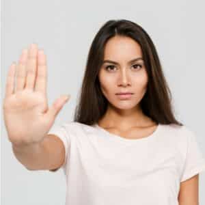 Woman holding her hand up to say stop