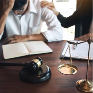 Image of upset defendant in a criminal court proceeding