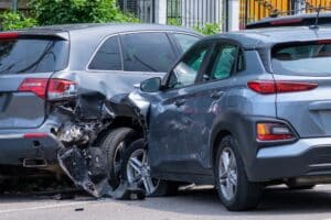 Image of a T-Bone style car accident with damage to both cars involved
