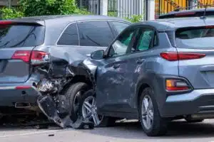 Image of a T-Bone style car accident with damage to both cars involved