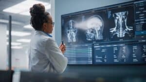 Doctor examining diagnostic studies in a hospital setting